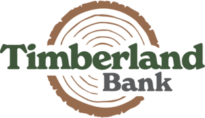 Timberland Bank logo with green and gray text over a brown tree ring graphic.