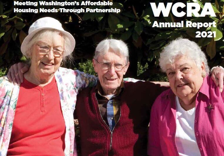 Three older adults sit closely together outdoors, smiling at the camera. Text reads, “Washington Community Reinvestment Association Annual Reports 2021: Meeting Washington’s Affordable Housing Needs Through Partnership.”.
