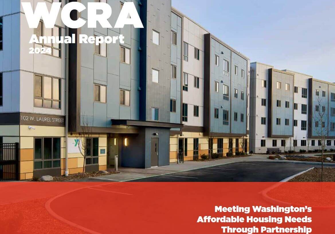 Modern apartment building exterior with sign reading “102 W. Laurel Street,” featured on the cover of the Washington Community Reinvestment Association annual reports, specifically the 2024 Annual Report about affordable housing in Washington.