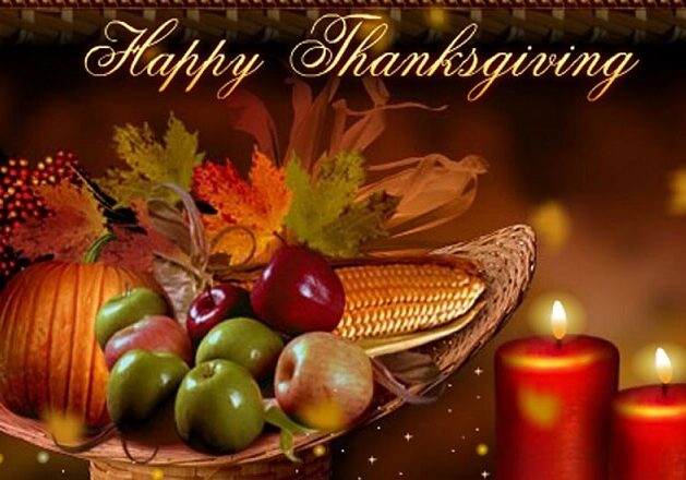 A cornucopia with apples, corn, and a pumpkin sits beside two lit candles and autumn leaves. “Happy Thanksgiving” is written at the top, celebrating the festive spirit with WCRA.