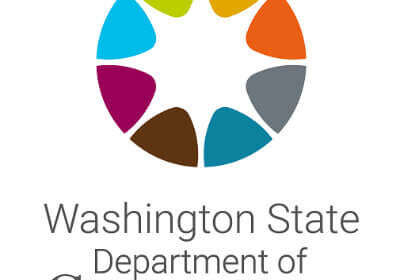 Washington State Department of Commerce logo with a circular, multicolored graphic above the organization’s name in gray and black text, reflecting its commitment to supporting businesses through free business trainings and online business trainings.