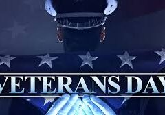 A person in uniform holds a folded American flag. Text in front reads “Veterans Day.” Stars from the flag are visible in the background, honoring the spirit of Veterans Day celebration.